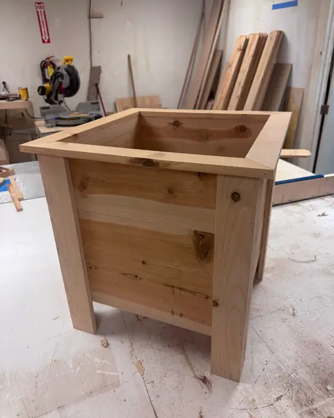 Square cedar planter with legs in the workshop